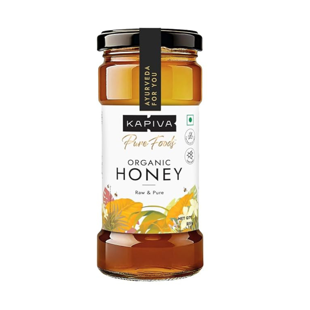 Kapiva Organic Honey jar, pure raw honey in spoon, Kapiva honey 500g packaging, natural honey splash close-up, honey dipper with golden honey, healthy honey for immunity, organic honey bottle on wooden table, Kapiva honey with fresh lemons and tea